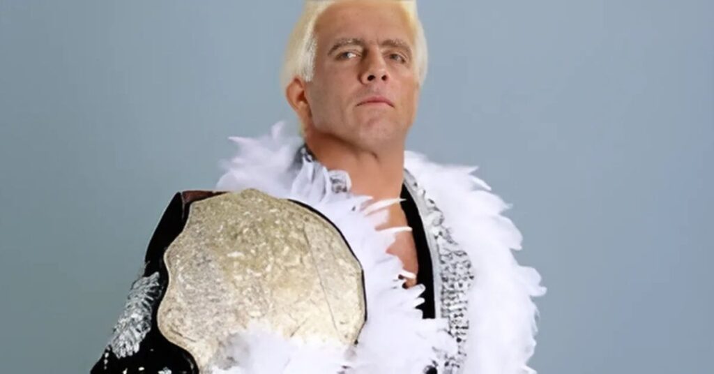 Ric Flair taking a winner belt