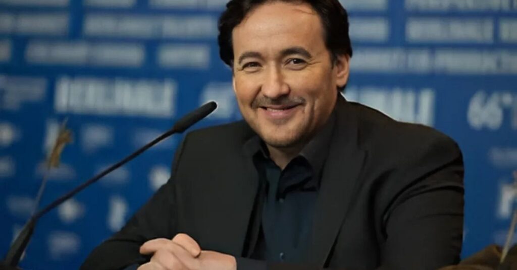 John Cusack is smiling