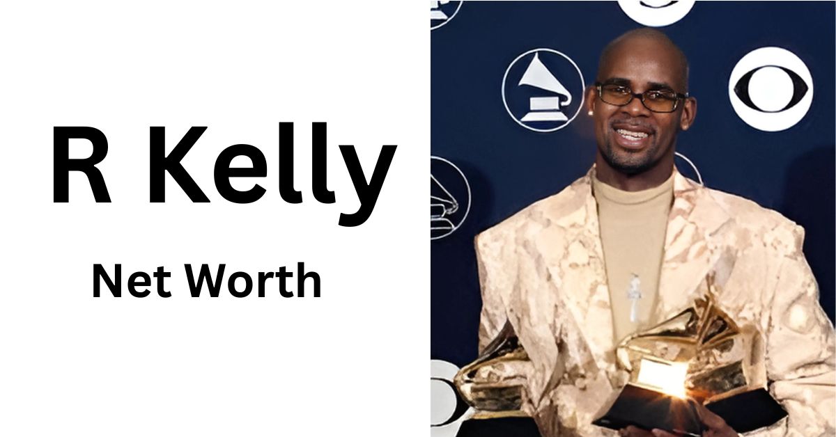 A person holding two Grammy awards in front of a blue wall.