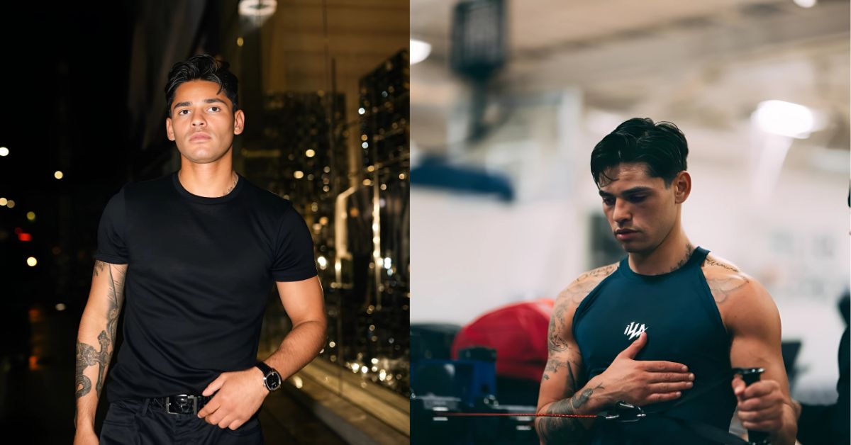 A person in a blue tank top is standing in a gym