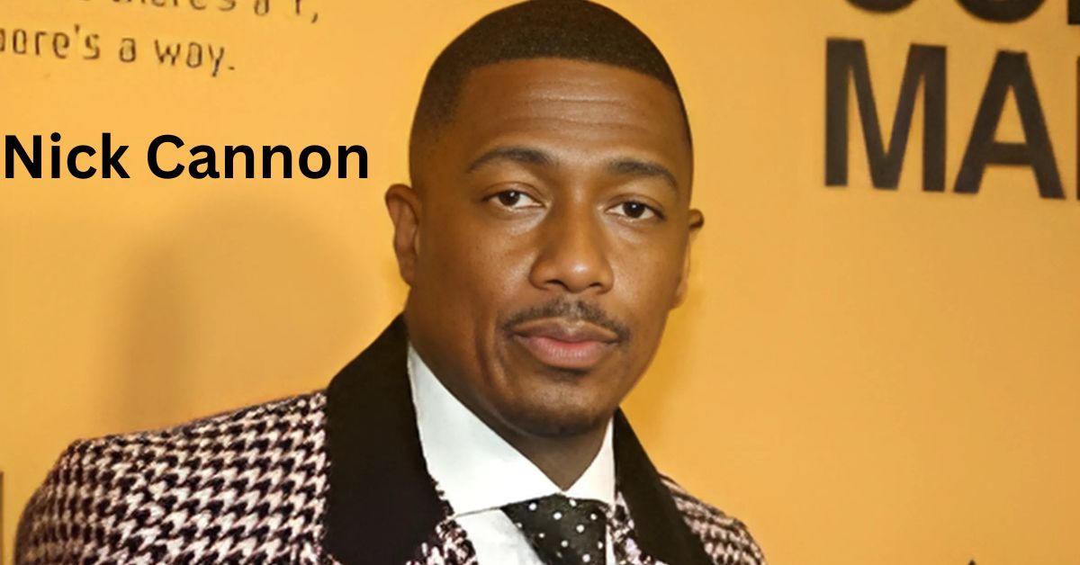 a person holding a flag in hip hop artist attends the premiere of a crowd