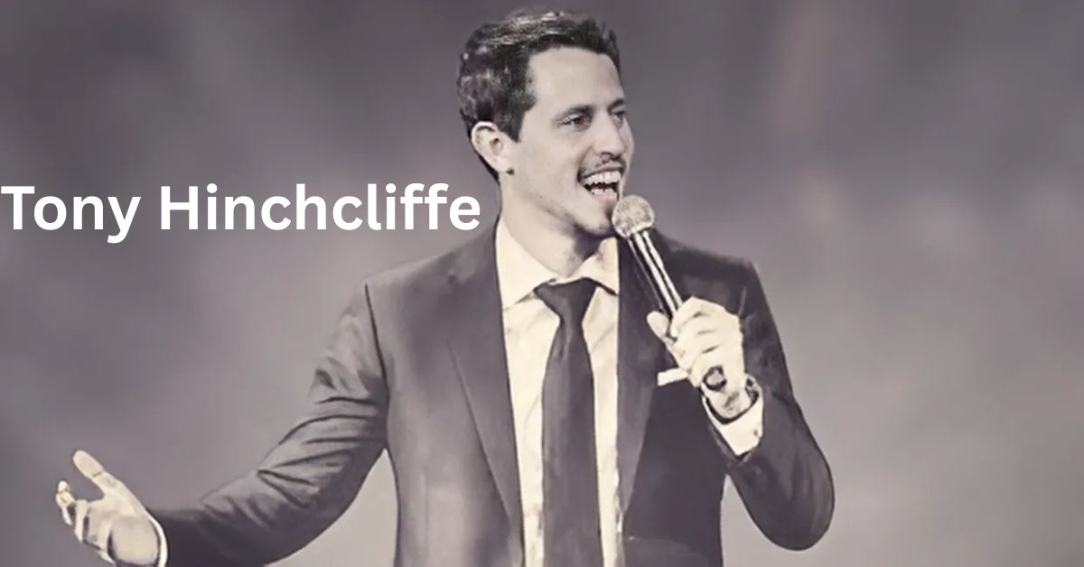 a person in a suit and tie is holding a microphone