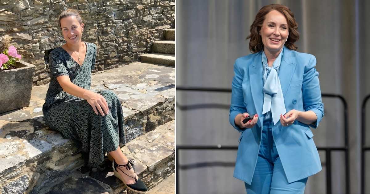 A person in a blue suit is standing on a stage