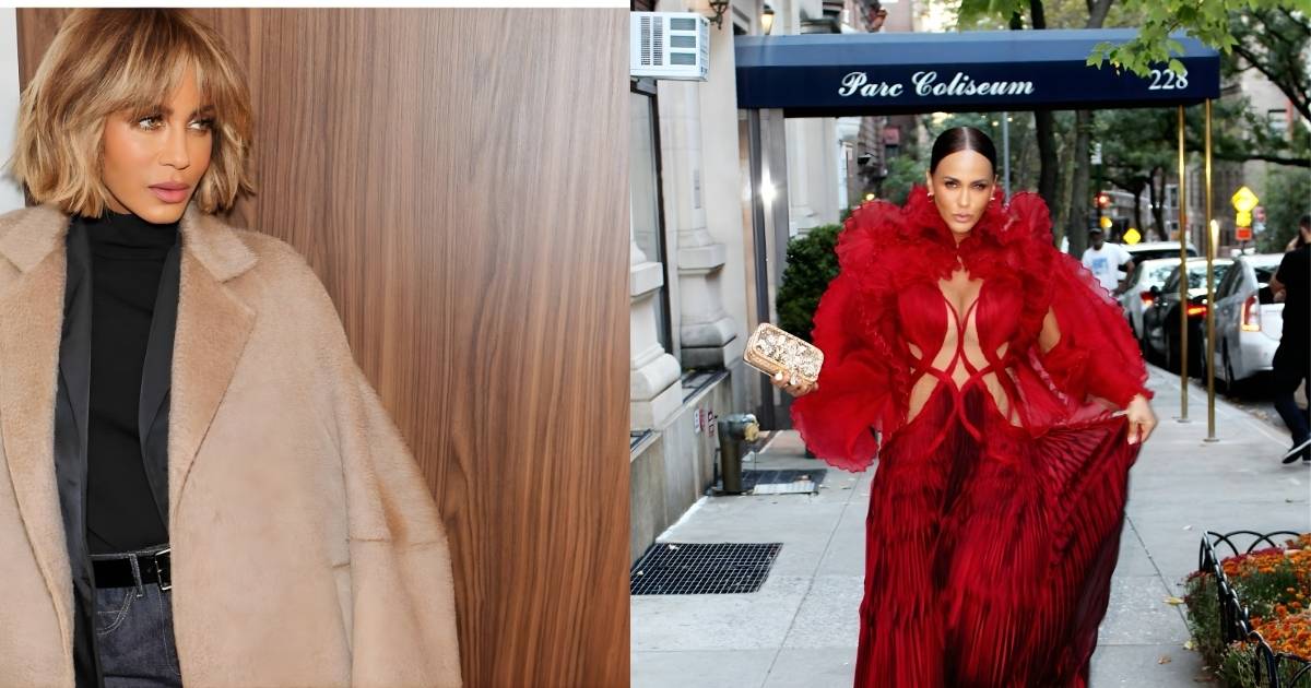 A person in a red gown is walking down the street