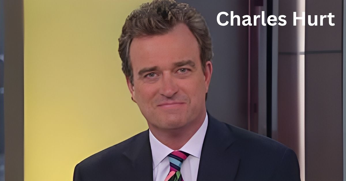 Charles Hurt in a suit and tie is on tv