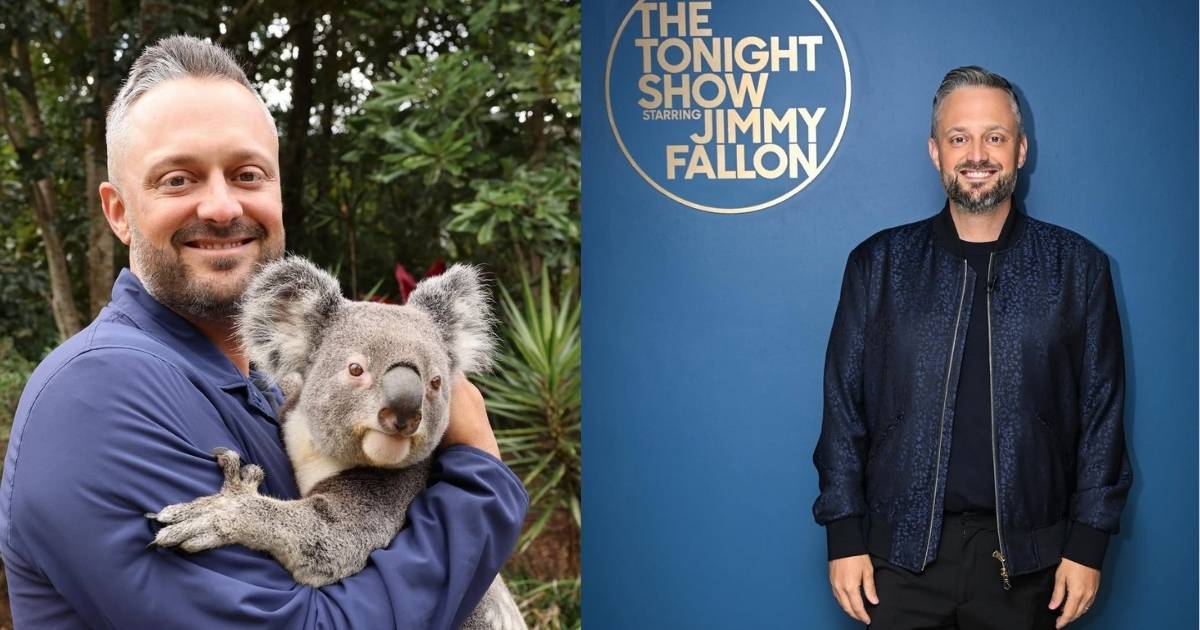 A person is holding a koala bear in their arms