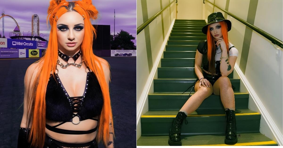 A person with orange hair sitting on some stairs
